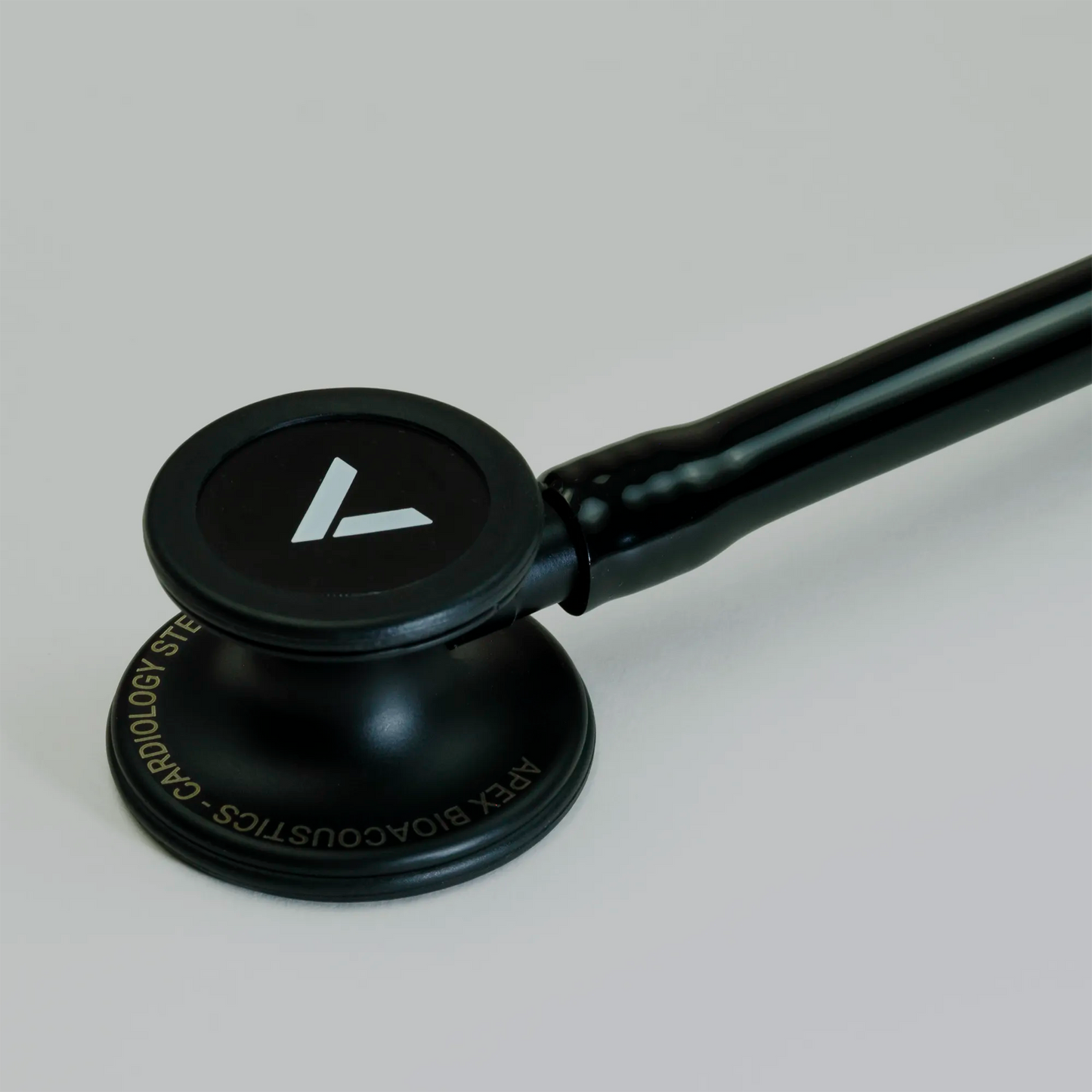 a black cardiology stethoscope chest piece