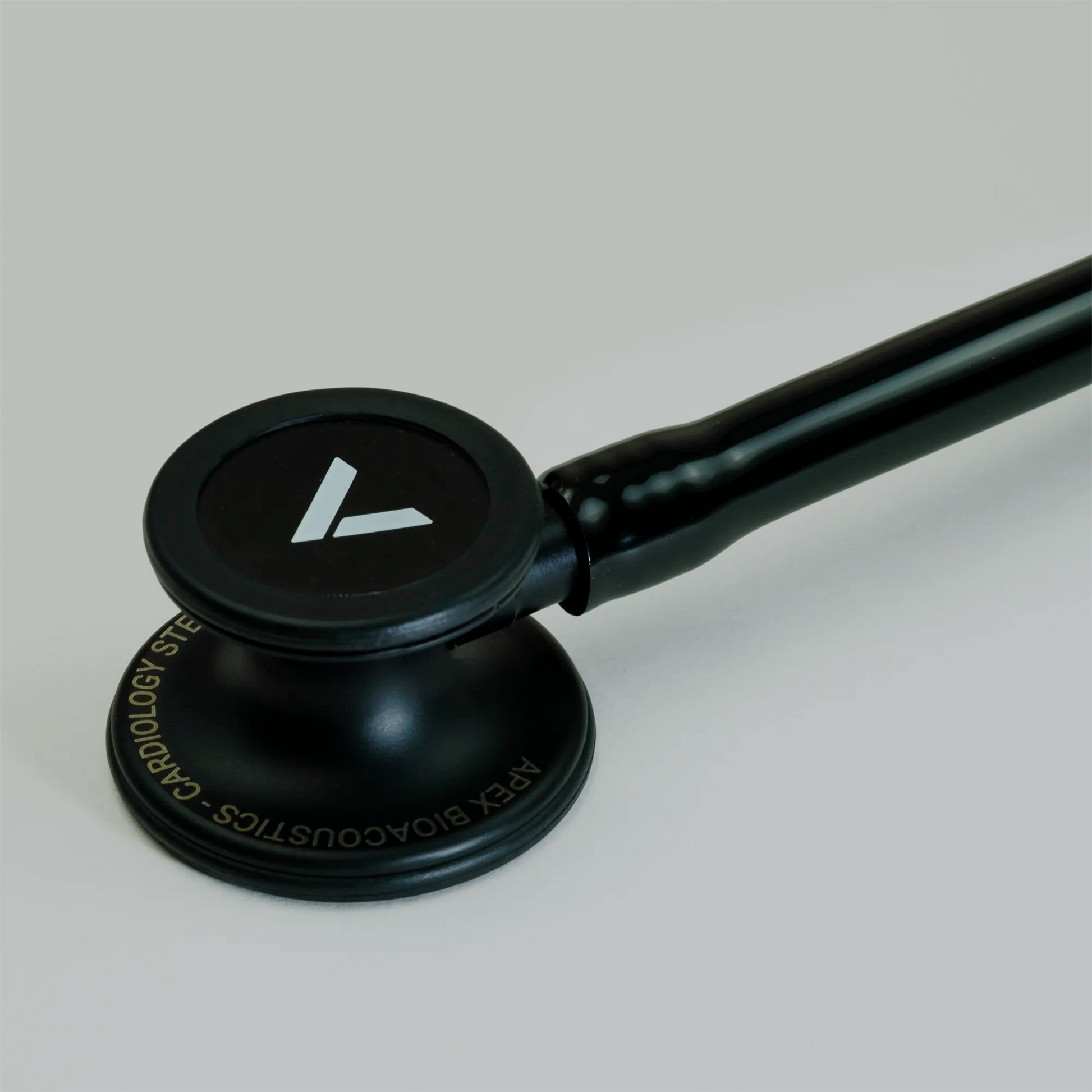 a black cardiology stethoscope chest piece