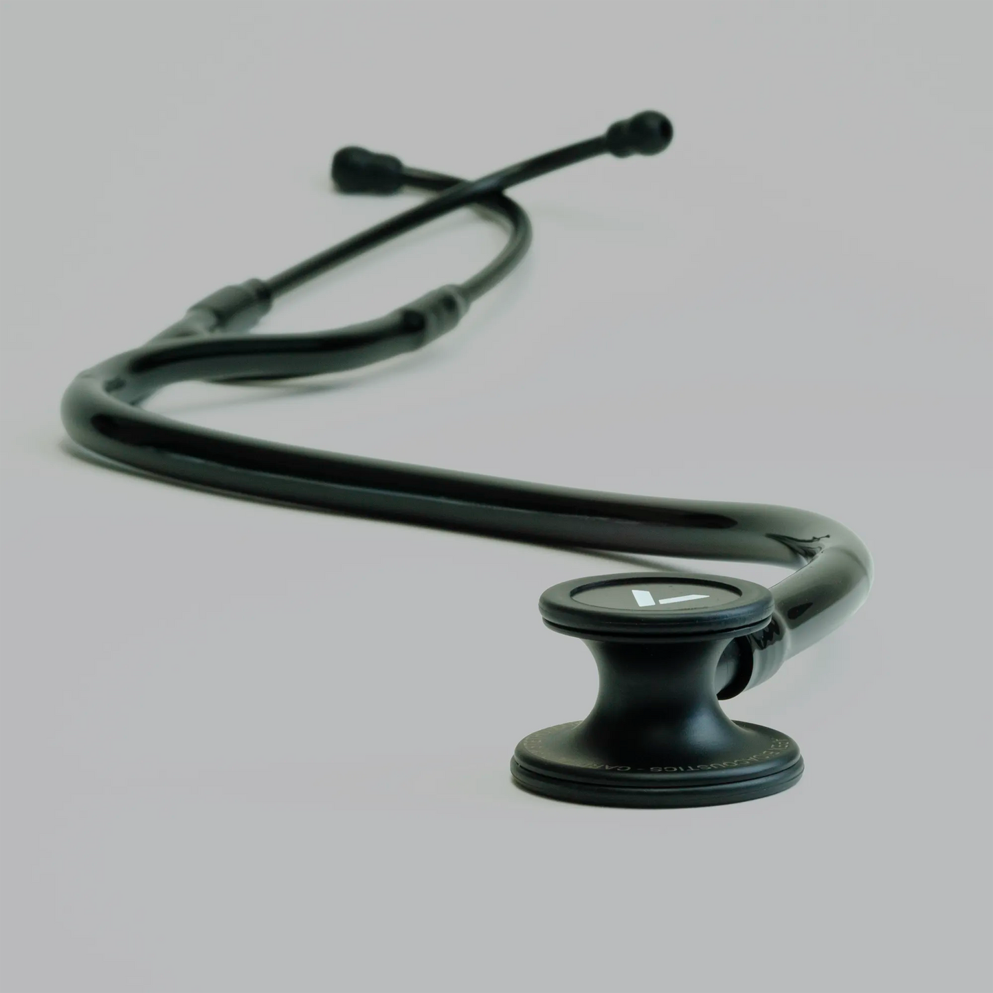 a long black cardiology stethoscope