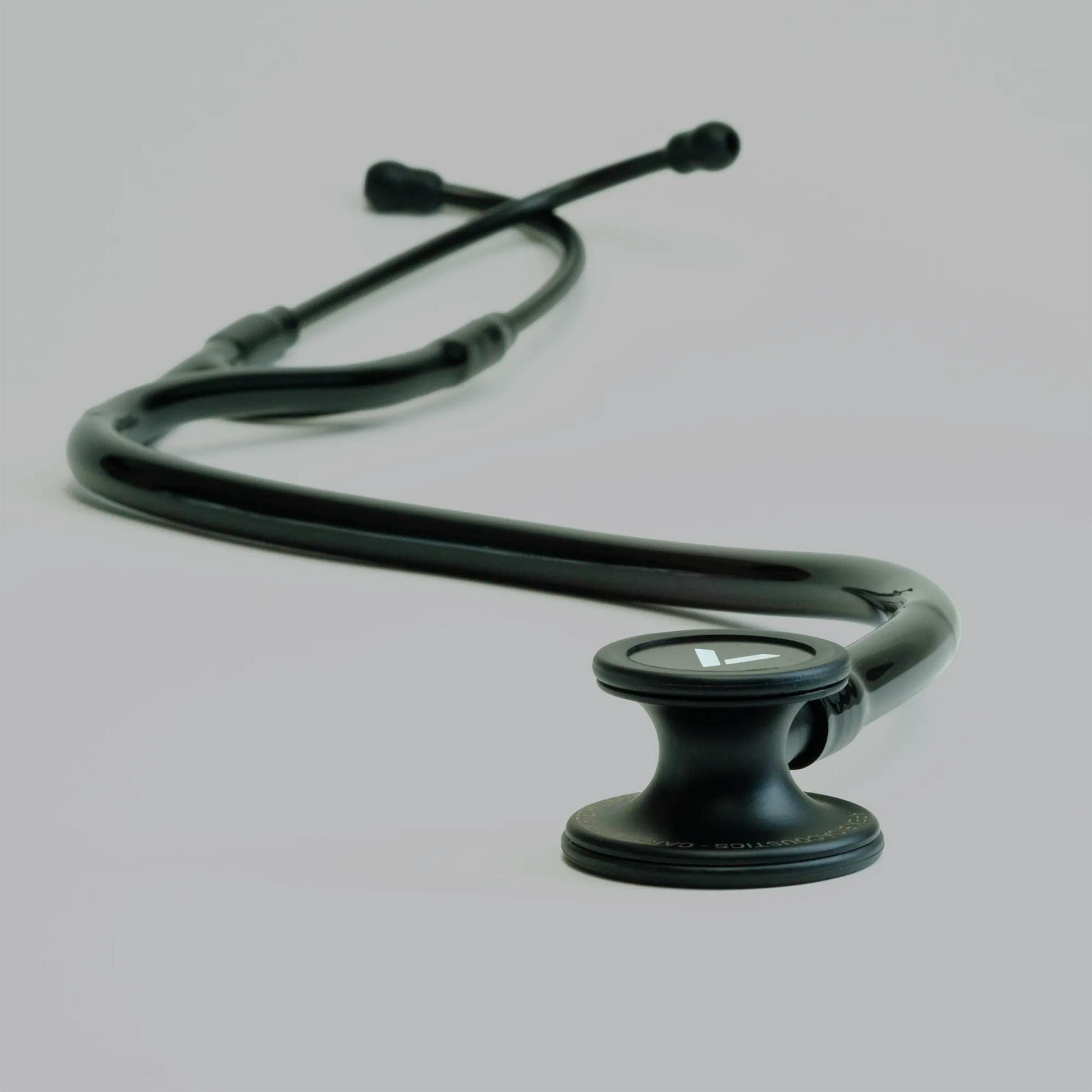 a long black cardiology stethoscope