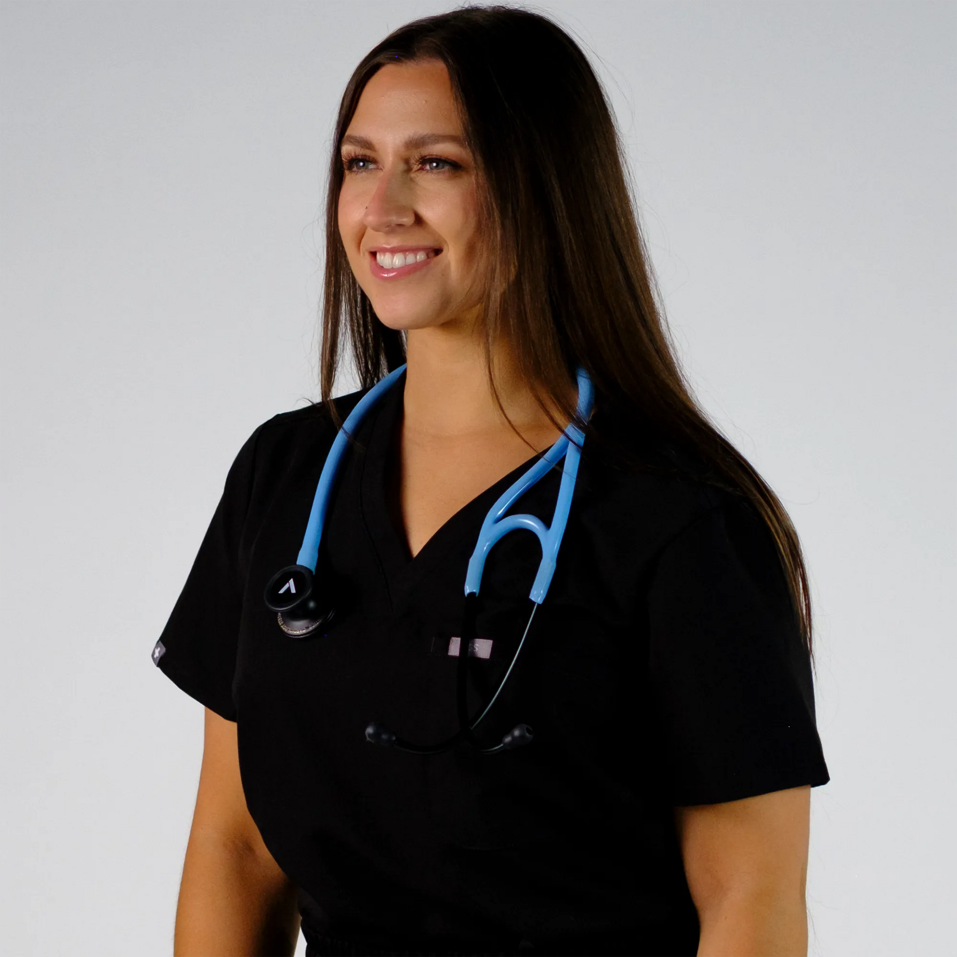 a model posing with  a blue cardiology stethoscope