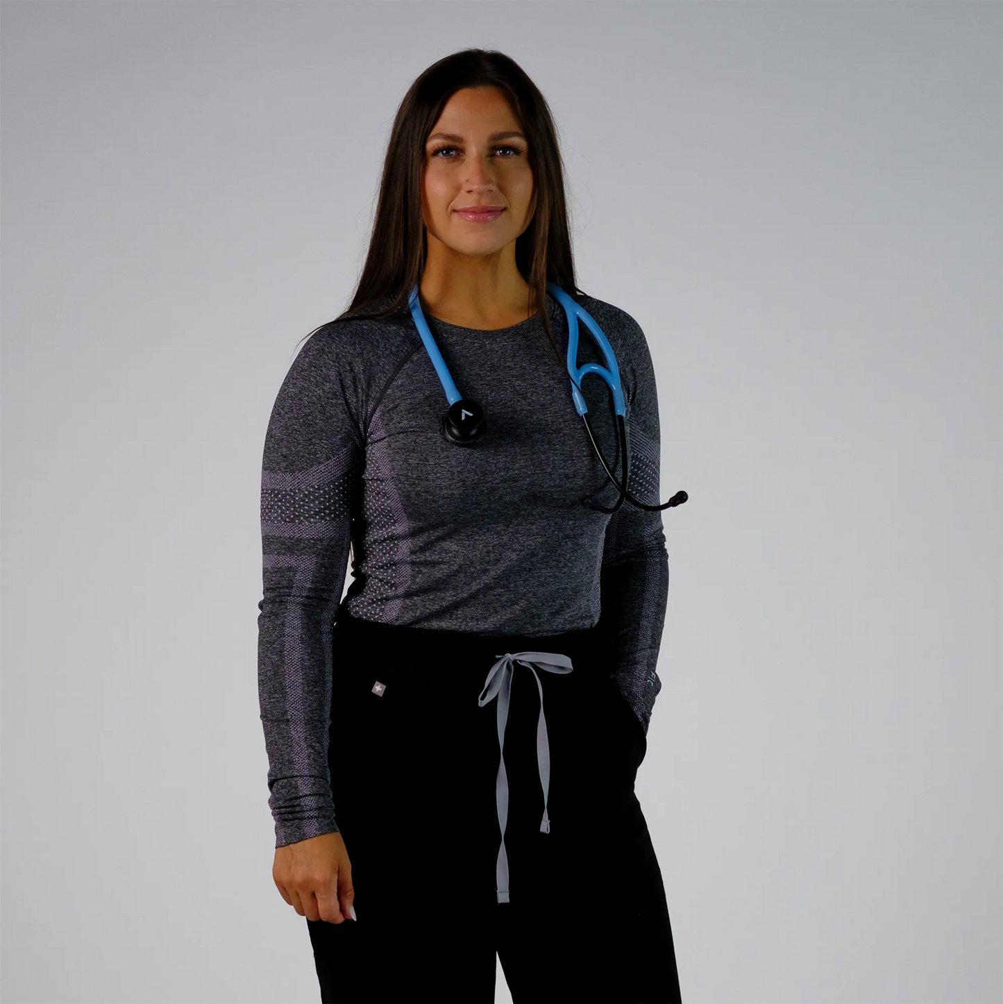  a model posing with a blue cardiology stethoscope