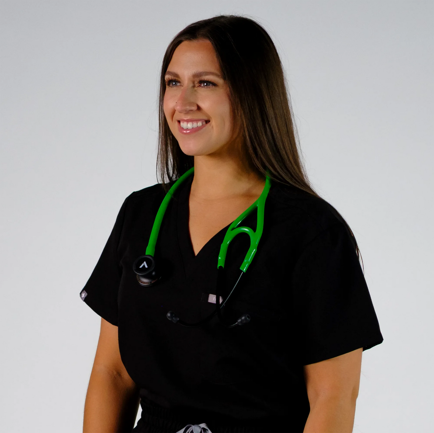 model happy with  a green cardiology stethoscope