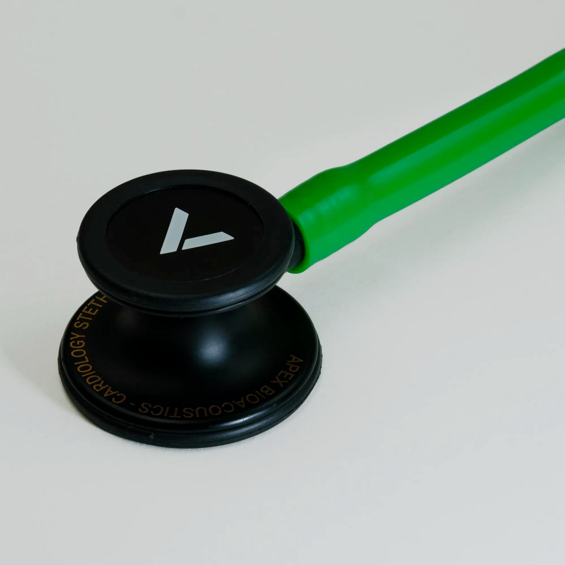  a green cardiology stethoscope chest piece