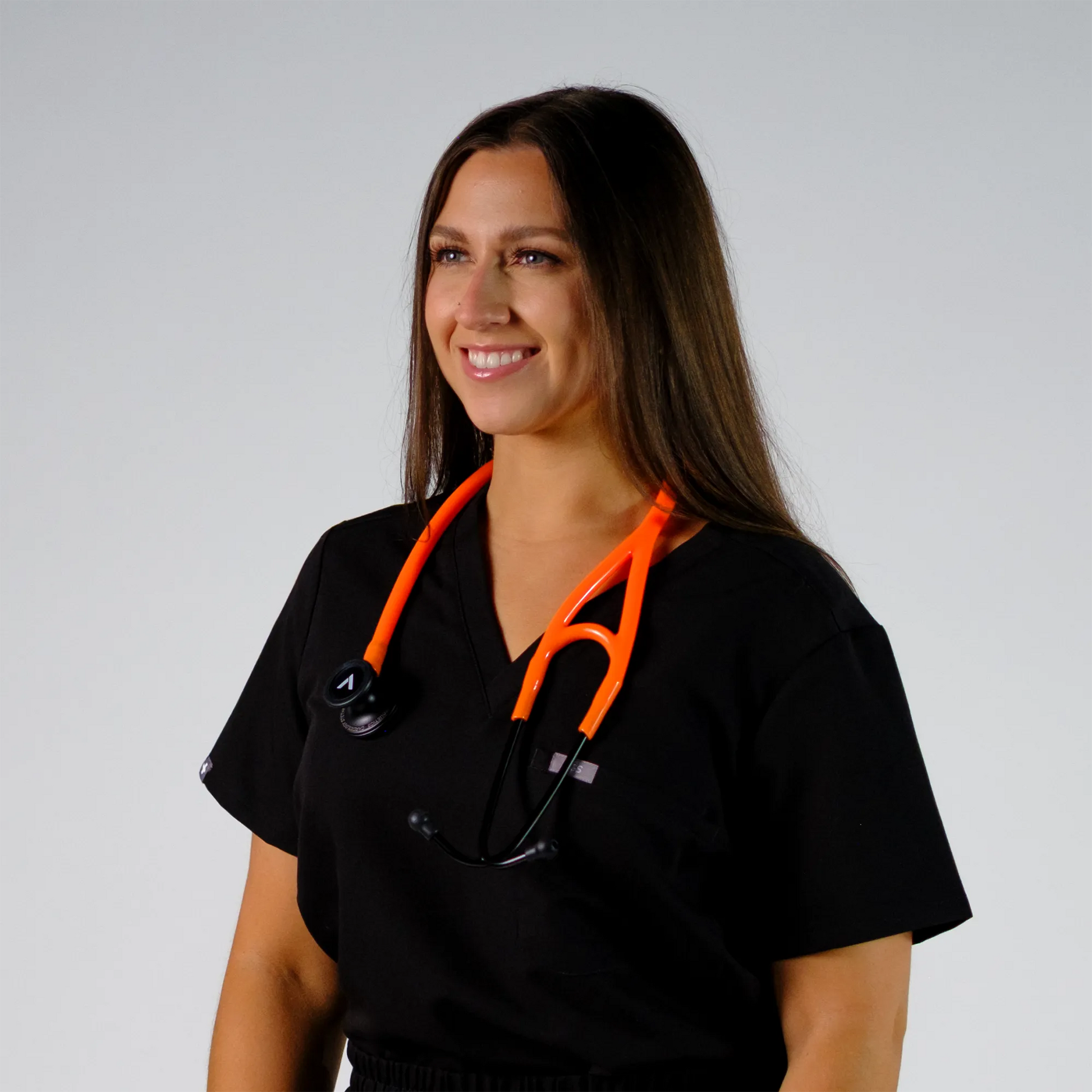 model happy with orange cardiology stethoscope