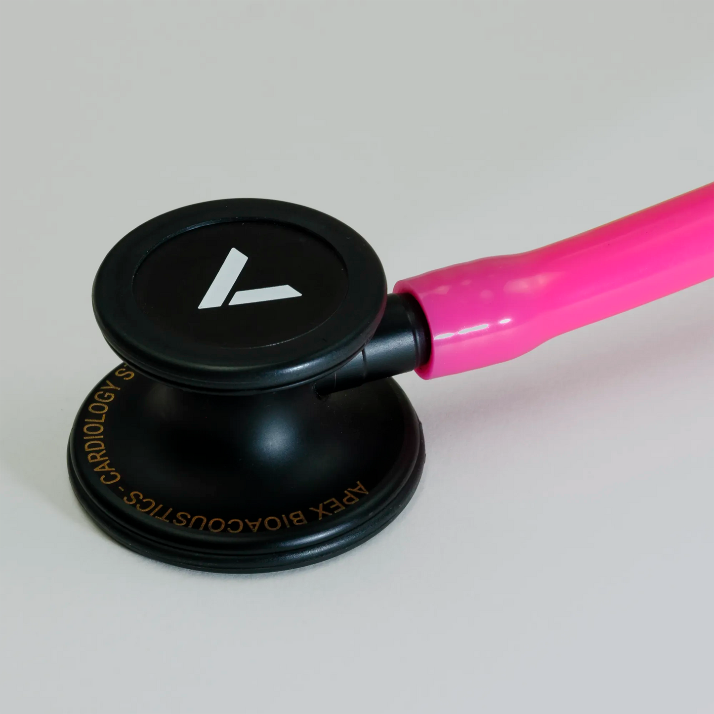  a pink cardiology stethoscope chest piece