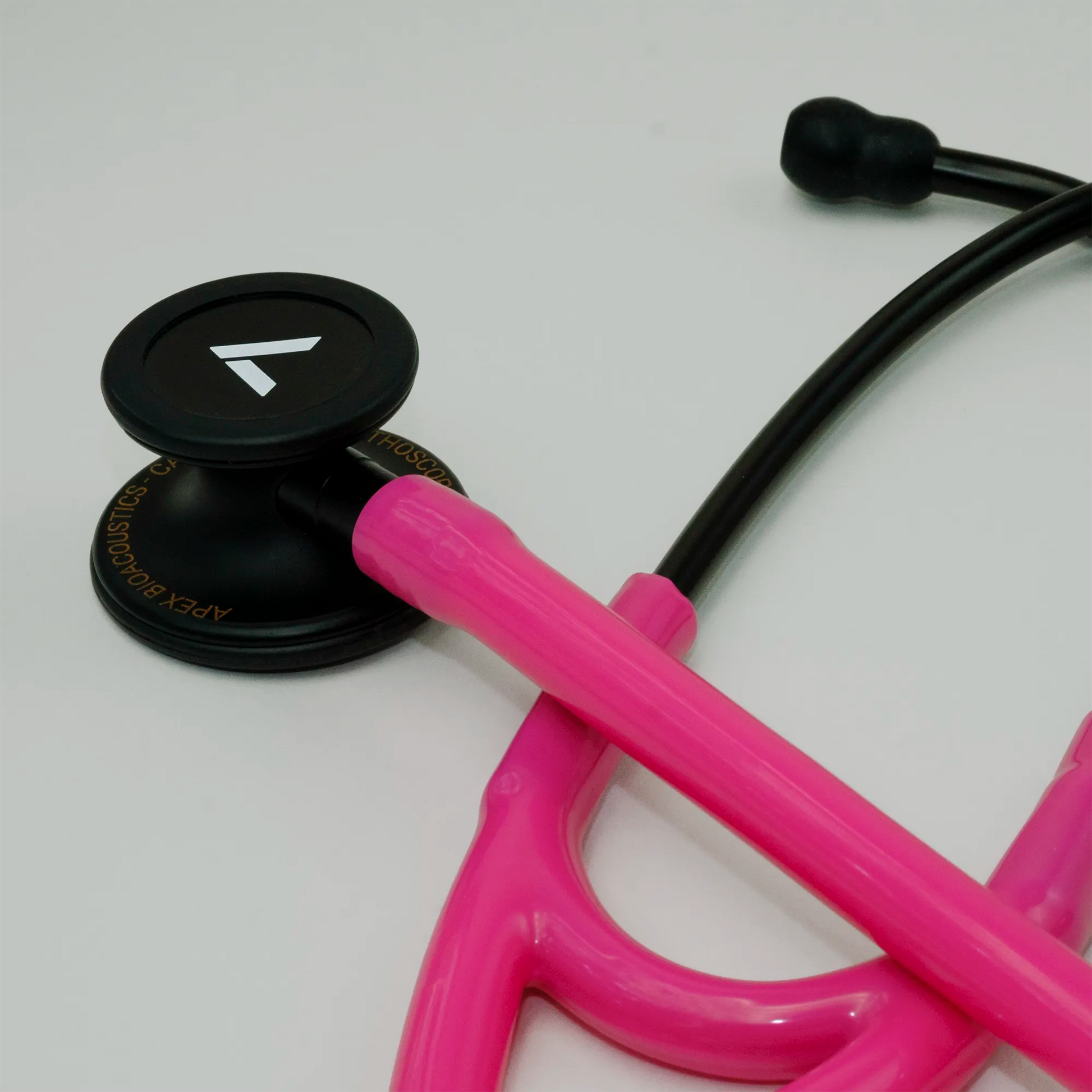 a pink cardiology stethoscope with ear tips