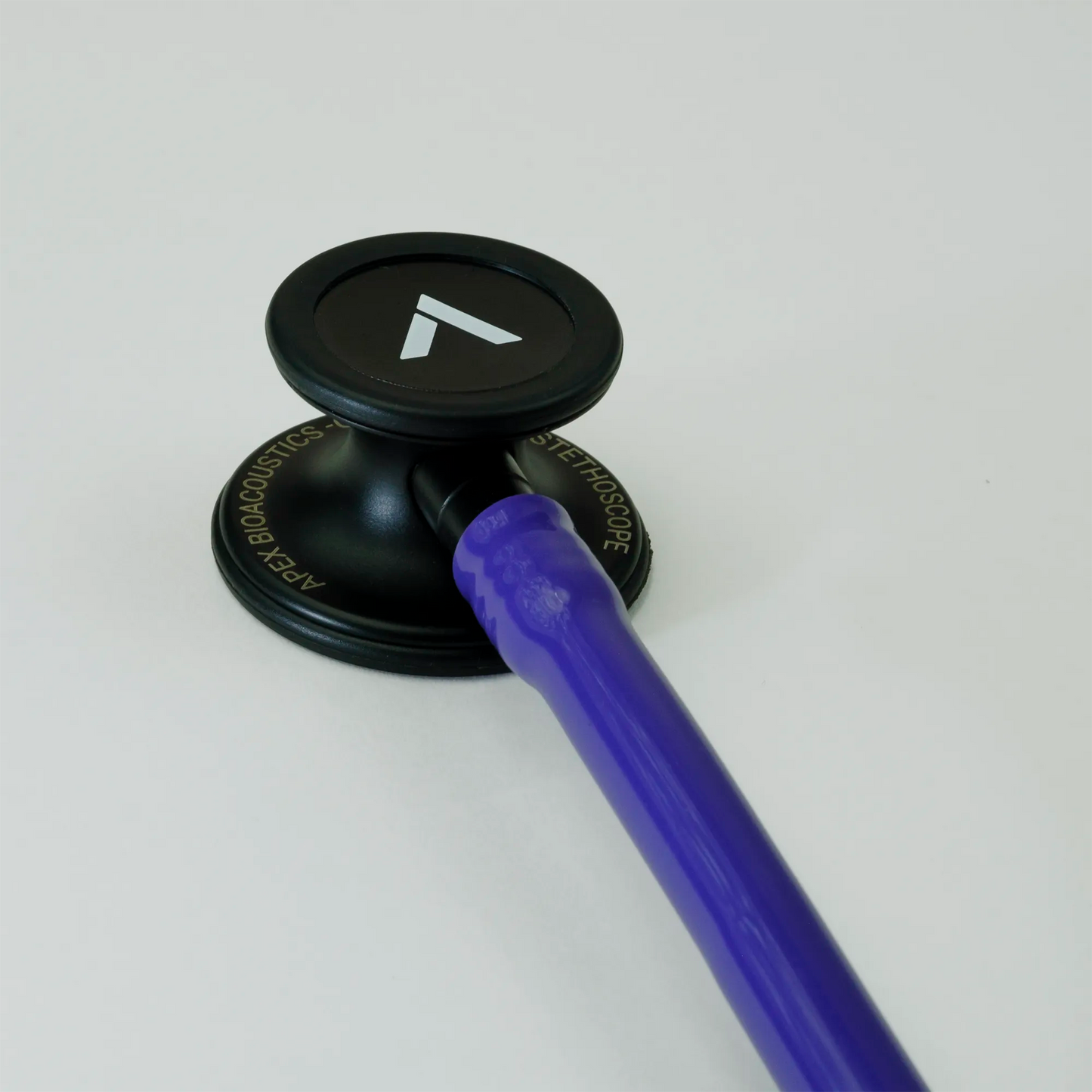  a purple cardiology stethoscope chest piece