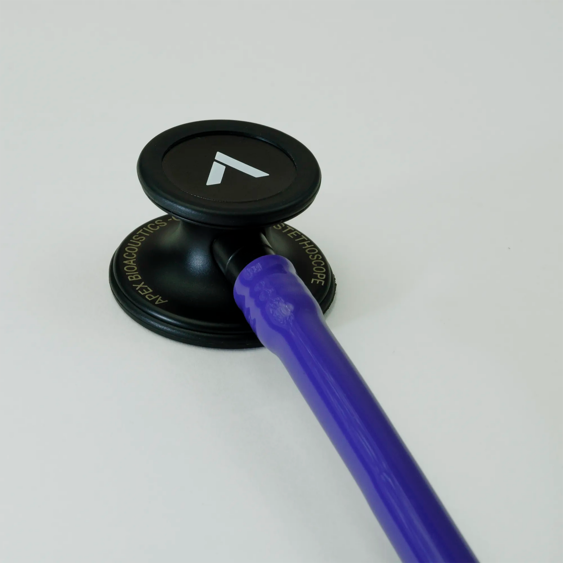  a purple cardiology stethoscope chest piece