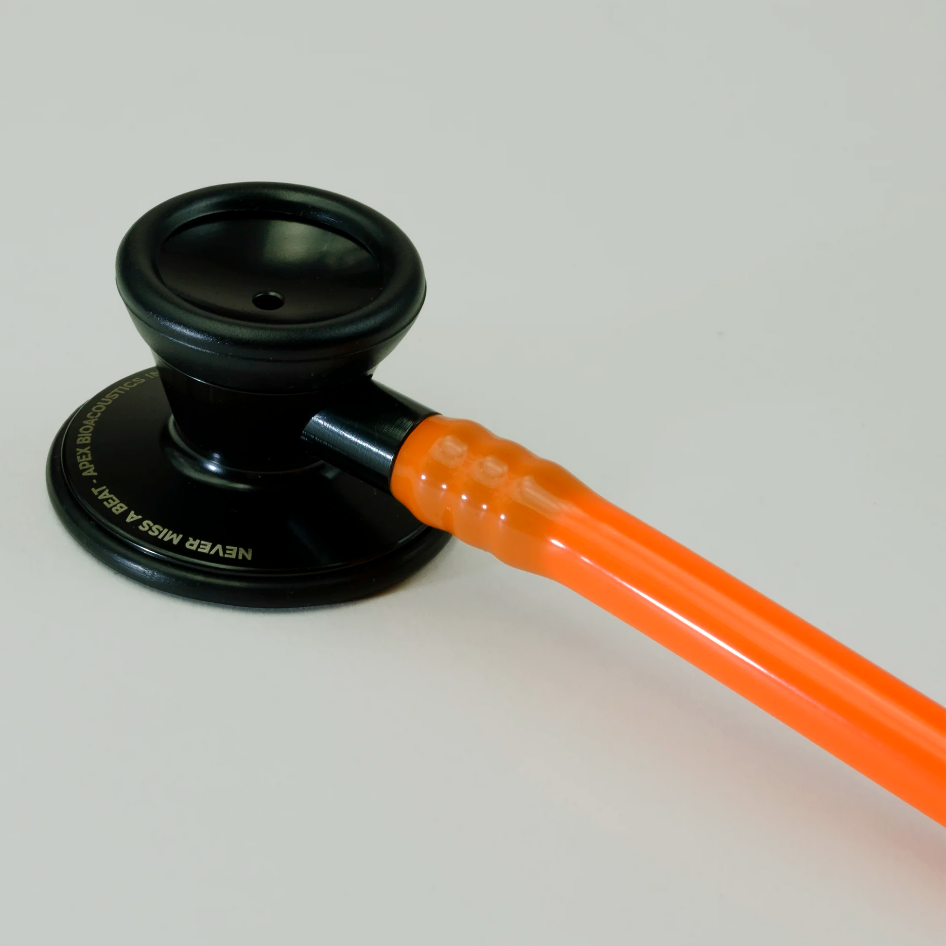 cardiology stethoscope orange tubing and chest piece