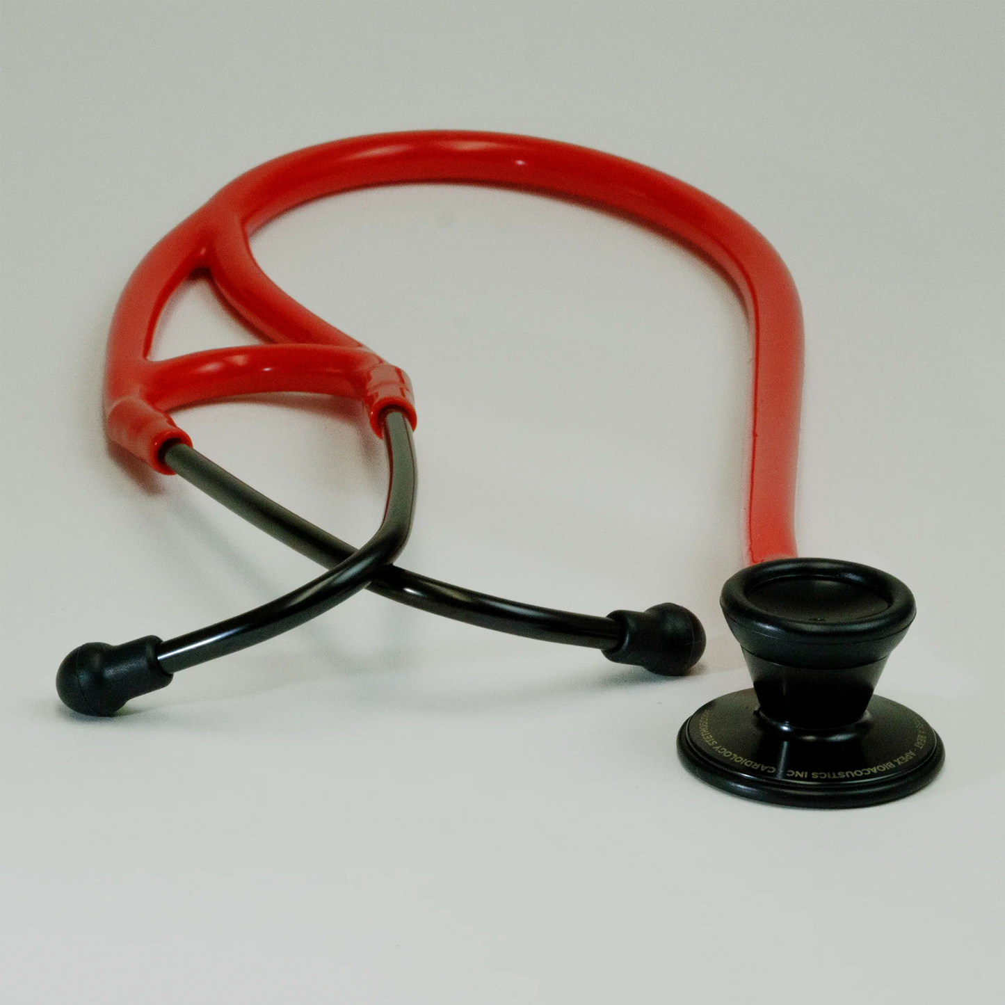 red curved cardiology stethoscope